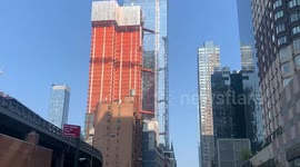 12 hurt when crane arm catches fire, collapses onto NYC street