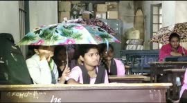 Students of government college in Dharwad forced to attend classes with umbrellas as the roof of the dilipated building leaks