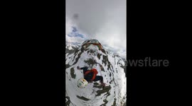 Paraglider Catches On Rock