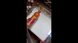 Artist flexes his stunning drawing skills with a HYPERREALISTIC depiction of a juice bottle