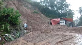 Locals run for cover when mudslide crashes down hillside in the Philippines