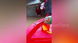 Rescue teams evacuate residents on rubber rafts as Typhoon Doksuri floods village in the Philippines