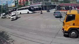 Near-miss accident as oncoming truck swerves to avoid bus turning at intersection