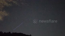 Starlink satelite glides across the night sky in Thailand