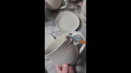 Skillful ceramist glazes the ceramic mug in base and color coats *Amazing Result*