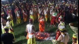 Devotees walk on burning embers during rituals as part of festival in northern India