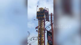 Rescuers scramble to aid people stuck at top of 22-metre rollercoaster