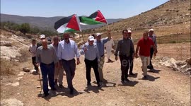 Palestinians argue with Israeli security forces during a protest against the establishment of Israeli outposts