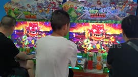 Citizens play games as China Game Industry Report released in Yichang, Hubei, China