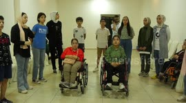 Palestinian with disabilities and their friends learn music during a summer camp in Gaza City