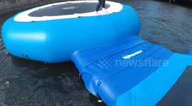 Kid slips on water assault course