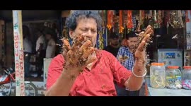 Thousands of bees sit on shopkeeper's face and body but never sting, creating a unique bond that leaves locals abuzz
