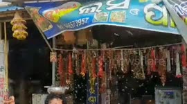 Better version : Thousands of bees sit on shopkeeper's face and body but never sting, creating a unique bond that leaves locals abuzz