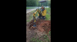 7-Year-Old Helps Dad Plant Trees With Mini Excavator