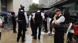 Police move in on Piers Corbyn as he protests outside the Royal Festival Hall where Greta Thunberg was speaking at an event called Greta Thunberg: The Climate Event