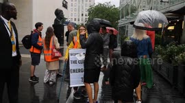 A Just Stop Oil Protestor talks to a Piers Corbyn supporter outside the Royal Festival Hall where Greta Thunberg was speaking at an event called Greta Thunberg: The Climate Event.