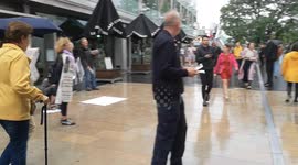 Piers Corbyn hands out a protest leaflet to a cameraman outside of the Royal Festival Hal. The leaflet called for the arrest of Greta Thunberg.. Video was shot outside the Royal Festival Hall where Greta Thunberg was speaking at an event called Greta Thun