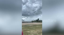 Storm batters beachside field in Thailand