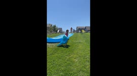 Woman Bellyflops Off Slip-and-Slide
