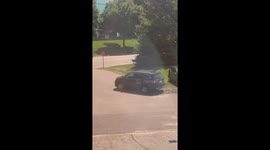 Man Struggles To Remove Rock From Under Car