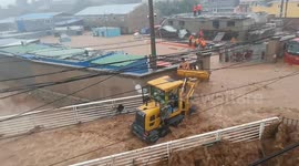 Man rescues family of three from torrential flood using tractor