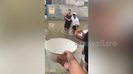 Locals hand out food to stricken residents in typhoon aftermath in the Philippines