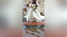 Wet wedding! Bride walks through flooded church amid typhoon aftermath (second angle)