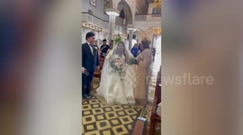 Bride walks down flooded aisle amid typhoon aftermath in the Philippines