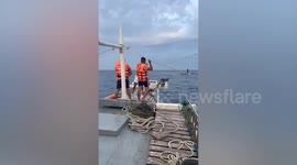 Fishermen rescued by Philippine Coast Guard when boat capsizes amid Super Typhoon Doksuri