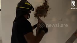 Firefighters Dig Hole In Wall To Rescue People Trapped In Lift In Madrid, Spain