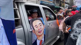 Protests parade murals of election winner now banned from government in Thailand