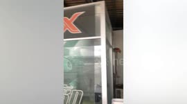 Worker plans elaborate rescue to take cat using chair... before it jumps down to save itself