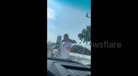 Man arrested for smashing car windscreen after crash in China