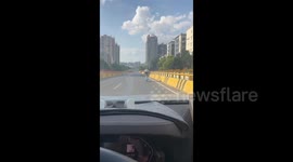 An Elderly Man Practices Yoga While Riding an Electric Bicycle in Hengyang, Hunan, China