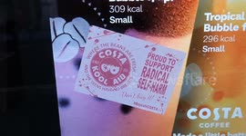 Stickers protesting Costa Coffee's post-op trans man mural stuck on London store