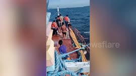 Fifty people rescued when boat sinks in rough waters off Philippine island