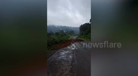 Road collapses following torrential rain in Cambodia