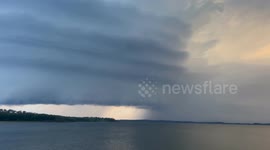 Beautiful stacked supercell thunderstorm over lake in central Alberta, Canada