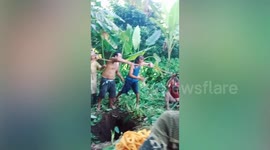Concerned neighbours rescue woman who fell into jungle pit in the Philippines