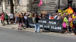 Climate protesters gather outside Downing Street in response to government issuing new oil and gas licences