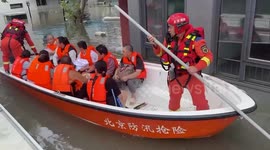 China's rescue effort and evacuations as rainfall hits capital