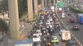 Traffic Jam Full of Motorcycles and Cars as air pollution getting worse in Jakarta, Indonesia
