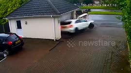 Shocking footage shows moment Mercedes-Benz smashes into garage