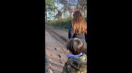 Muddy Riverbank Causes Family Mess