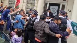 British-Pakistanis protest Imran Khan's three-year prison sentence as counter-protesters celebrate raising flag outside the Pakistan High Commission in London