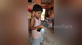 A small Indian girl sending message love with pigeon