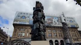 Pigeons perfectly merge into the briefcases tower of Paris Saint-Lazare train station. France. 6 aug 2023