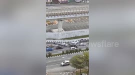 Police open fire at driver fleeing along congested road in Malaysia