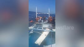 One dead and dozens of passengers rescued when 'overloaded' boat capsizes in the Philippines