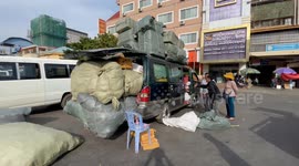 Market customer crams their shopping into every last space of their car